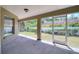 Relaxing screened patio overlooking a well-maintained backyard at 513 Tweed Ave, Seffner, FL 33584