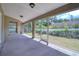 Relaxing screened patio overlooking a well-maintained backyard at 513 Tweed Ave, Seffner, FL 33584