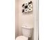 Close up of toilet with decorative tic-tac-toe shelving at 513 Tweed Ave, Seffner, FL 33584