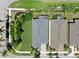 An aerial view shows the backyard, mature landscaping, and proximity to neighbors at 5239 Admiral Pointe Dr, Apollo Beach, FL 33572