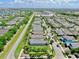 Aerial view of a neighborhood featuring charming single-Gathering homes with mature trees and landscaping at 5239 Admiral Pointe Dr, Apollo Beach, FL 33572