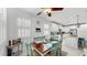 Cozy dining room with plantation shutters, a wooden table, and seating for six at 5239 Admiral Pointe Dr, Apollo Beach, FL 33572