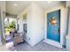 Charming front porch with turtle door decor, brick flooring, and 'Home Sweet Home' door mat at 5239 Admiral Pointe Dr, Apollo Beach, FL 33572