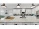 Spacious kitchen boasts white cabinets, granite countertops, stainless steel appliances, and a large island at 5239 Admiral Pointe Dr, Apollo Beach, FL 33572