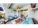 Relaxing lanai space with comfortable seating, ceiling fan, and serene decor elements at 5239 Admiral Pointe Dr, Apollo Beach, FL 33572