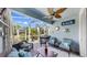 Inviting lanai with ample seating, a ceiling fan, and serene outdoor ambiance at 5239 Admiral Pointe Dr, Apollo Beach, FL 33572