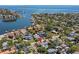 Aerial view of property with waterfront and neighborhood views in the background at 556 21St Ne Ave, St Petersburg, FL 33704