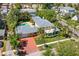 Aerial view of the property showcasing its lush landscaping, pool, and proximity to surrounding neighborhood at 556 21St Ne Ave, St Petersburg, FL 33704