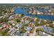 Expansive aerial view of a neighborhood with a charming home, mature trees, and waterfront access at 556 21St Ne Ave, St Petersburg, FL 33704