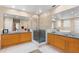Well lit bathroom with dual vanities, tiled shower, and separate tub at 556 21St Ne Ave, St Petersburg, FL 33704