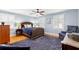 Light-filled bedroom with a stylish bed, matching lamps, and blue walls complemented by white trim at 556 21St Ne Ave, St Petersburg, FL 33704