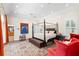 Spacious bedroom with a four-poster bed, a large rug, and abundant natural light at 556 21St Ne Ave, St Petersburg, FL 33704
