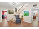 Inviting entryway with hardwood floors, staircase, and striking artwork at 556 21St Ne Ave, St Petersburg, FL 33704