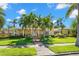 Beautiful two-story home featuring a welcoming porch, detailed trim, and meticulously kept grounds at 556 21St Ne Ave, St Petersburg, FL 33704