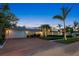 Elegant home featuring a brick driveway, meticulous landscaping and an attached garage at 556 21St Ne Ave, St Petersburg, FL 33704