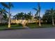 Inviting two-story home with a charming front porch, well-lit landscaping, and a welcoming atmosphere at 556 21St Ne Ave, St Petersburg, FL 33704