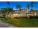 Beautiful two-story home with a covered porch, mature landscaping, and a serene neighborhood setting at 556 21St Ne Ave, St Petersburg, FL 33704