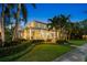 Lovely two-story home featuring a welcoming porch, detailed trim, and meticulously kept grounds at 556 21St Ne Ave, St Petersburg, FL 33704