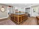 Well-equipped kitchen with a spacious island, custom cabinets, and modern stainless steel fridge at 556 21St Ne Ave, St Petersburg, FL 33704