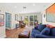 Sunlit living room with sliding doors leading to the outdoor pool area and patio at 556 21St Ne Ave, St Petersburg, FL 33704
