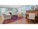 Inviting living room with fireplace, hardwood floors, and large windows at 556 21St Ne Ave, St Petersburg, FL 33704