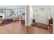 Spacious living room with hardwood floors, fireplace, and a front door entrance leading to an elegant foyer at 556 21St Ne Ave, St Petersburg, FL 33704