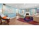 Bright living room featuring beautiful blue walls, fire place, and an artistic painting at 556 21St Ne Ave, St Petersburg, FL 33704