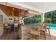 Outdoor bar and entertainment area by the pool, featuring a granite counter and wood ceiling at 556 21St Ne Ave, St Petersburg, FL 33704