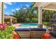 Comfortable outdoor seating area with view of the pool and outdoor bar at 556 21St Ne Ave, St Petersburg, FL 33704