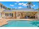 Outdoor pool with an outdoor kitchen and bar area, perfect for entertaining guests at 556 21St Ne Ave, St Petersburg, FL 33704