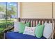 Comfortable porch swing with cozy pillows perfect for relaxing outdoors at 556 21St Ne Ave, St Petersburg, FL 33704