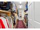 Spacious walk-in closet with ample storage, wooden shelving, and a decorative rug at 556 21St Ne Ave, St Petersburg, FL 33704