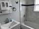 Updated bathroom features a shower-tub combo with modern fixtures, vanity and sink at 633 47Th N Ave, St Petersburg, FL 33703