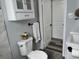 Nicely remodeled bathroom featuring a modern toilet, cabinetry, and updated fixtures at 633 47Th N Ave, St Petersburg, FL 33703