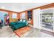 Spacious bedroom with sliding glass door, wood-look floors, and a walk-in closet at 633 47Th N Ave, St Petersburg, FL 33703