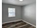 This bedroom features wood-look floors and lots of natural light at 633 47Th N Ave, St Petersburg, FL 33703