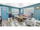 Bright living room with sleek flooring, comfortable seating, and a view of the entrance at 633 47Th N Ave, St Petersburg, FL 33703