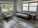 Well-lit room with new wood-look flooring and large windows that provide plenty of natural light at 633 47Th N Ave, St Petersburg, FL 33703