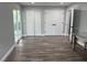 The room features a modern hardwood floor and glass doors that provide natural light at 633 47Th N Ave, St Petersburg, FL 33703