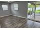 Spacious living room with sliding glass doors leading to outdoor patio and backyard at 633 47Th N Ave, St Petersburg, FL 33703