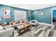 Stylish living room featuring modern furniture, decorative artwork, and appealing flooring at 633 47Th N Ave, St Petersburg, FL 33703