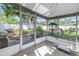 Inviting screened porch with a cozy atmosphere and a view of the backyard at 633 47Th N Ave, St Petersburg, FL 33703