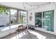 Sunlit screened porch with views of the backyard, perfect for dining at 633 47Th N Ave, St Petersburg, FL 33703