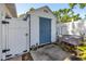 Charming shed with blue doors, adding character and functionality to the backyard at 633 47Th N Ave, St Petersburg, FL 33703