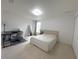 Cozy bedroom with desk, modern bed frame, plush carpet, and ample natural light at 7044 Brickell Ct, Spring Hill, FL 34609