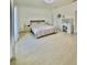 Bright bedroom features a neutral color palette, wood floors and a decorative vanity at 7044 Brickell Ct, Spring Hill, FL 34609