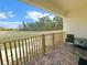 Private patio with lush outdoor view, outdoor seating, and tile flooring at 7044 Brickell Ct, Spring Hill, FL 34609