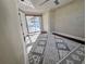 Bedroom with large sliding glass door providing access to outdoor pool area at 7114 Parrot Dr, Port Richey, FL 34668
