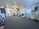 Spacious garage with washer, dryer, utility sink, and bright ceiling fan at 7114 Parrot Dr, Port Richey, FL 34668