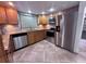 Modern kitchen with stainless steel appliances, granite countertops, and ample cabinet space at 7114 Parrot Dr, Port Richey, FL 34668